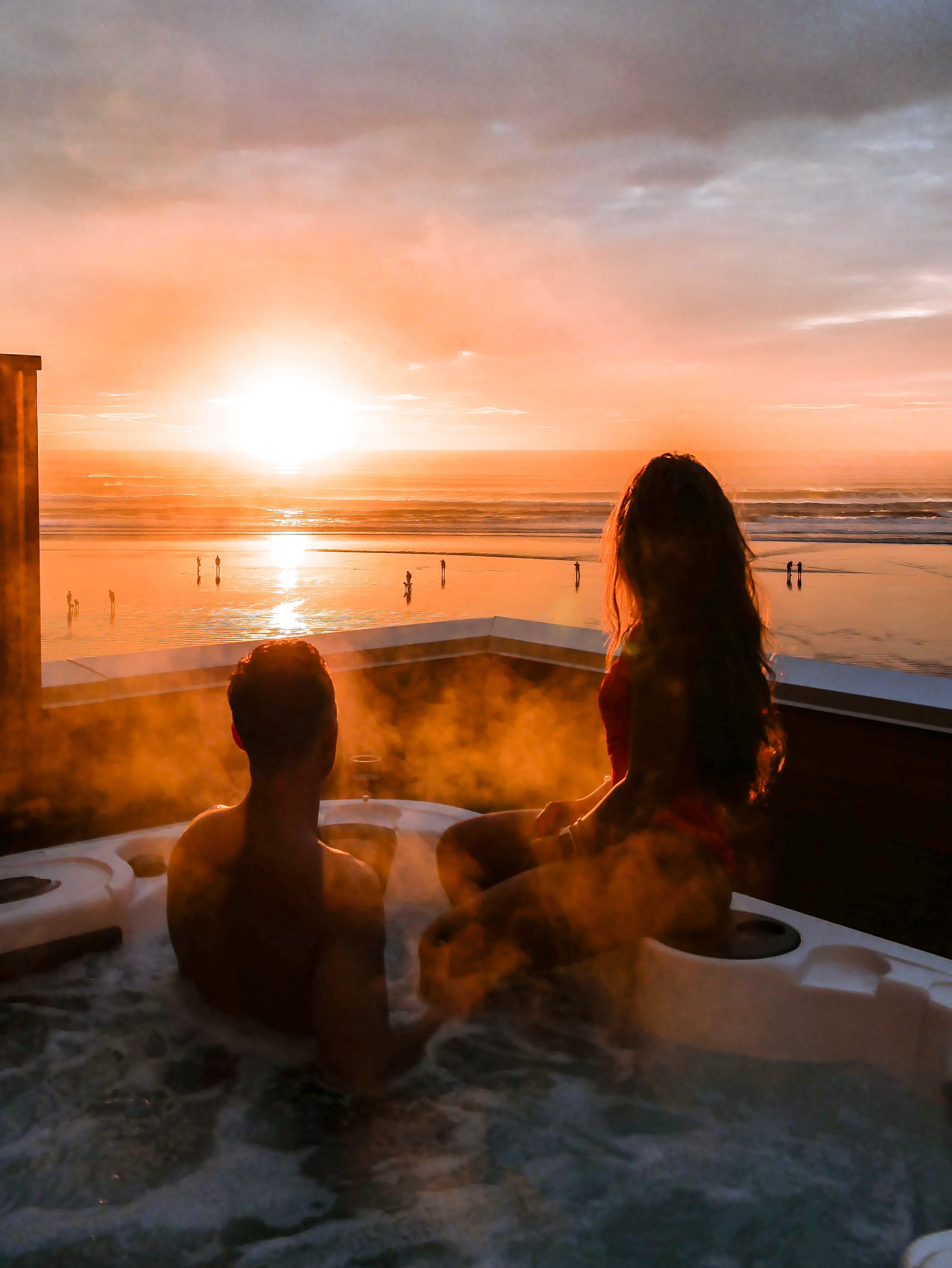 Sunset hot tub by beach in Tofino